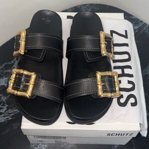 SCHUTZ Enola Black Leather Sandals Slides Gold Accents Size 8.5 AUTHENTIC NEW